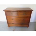 A circa 1900's satinwood chest of two over three drawers on bun feet - Height 92cm x 111cm x