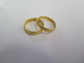 Two 22ct hallmarked yellow gold band rings sizes M and J - total weight approx 6.5 grams - both