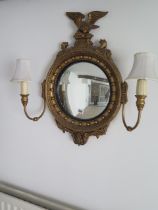 A Georgian style gilt girondale wood wall mirror with two side lights