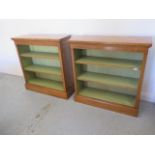 A pair of burr oak open bookcases with adjustable shelves and painted interior - made by a local