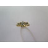 An 18ct yellow gold three stone diamond ring size Q - approx weight 3.7 grams - good condition,