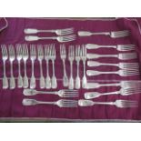 A collection of 24 silver forks - 12 x 20cm and 12 x 17cm - assorted makers and dates - total weight