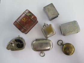 Three base metal coin cases, a plated vesta, a Rams head vesta and a plated matchbox case and