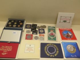 Eight mint coin packs, assorted commemorative coins