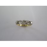 An 18ct yellow gold and platinum five stone diamond ring - the central diamond approx 0.24ct -