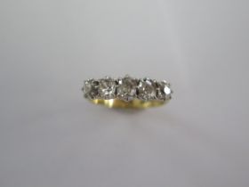 An 18ct yellow gold and platinum five stone diamond ring - the central diamond approx 0.24ct -