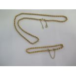 A 9ct yellow gold rope twist 46cm necklace and a 9ct yellow gold bracelet - total weight approx 7.