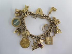 A 9ct yellow gold charm bracelet with an Edward VII gold half sovereign dated 1909 with 13