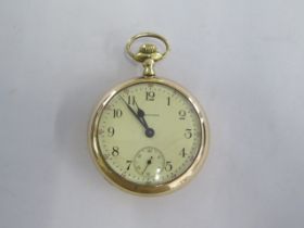 A gold plated Waltham top wind open face pocket watch - 54mm case - in running order, cracks to dial