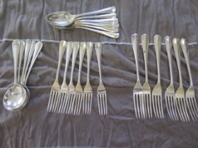 A silver six piece matching cutlery set - Six table forks, six side forks, six soup spoons and six