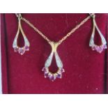 A 9ct yellow gold pendant on chain and matching earring set - approx weight 3.8 grams