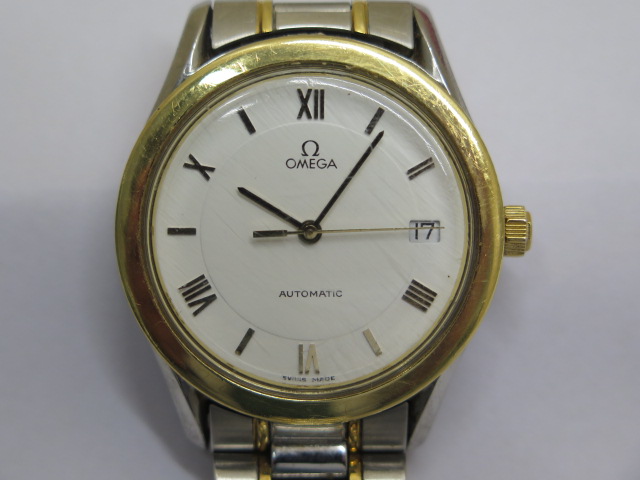 An Omega Automatic date 1061 gents wristwatch with white dial and 35mm case on an Omega