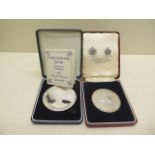 A Spink and Son Silver Jubilee coin, 76 grams and a Faulkland Islands £25 silver coin, 150 grams