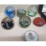 A collection of seven paperweights