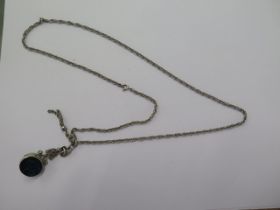 A white metal fob on a 66cm chain