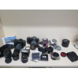 Two 35mm SLR cameras Canon T80 and Chinon CP-7m with assorted lens and attachments