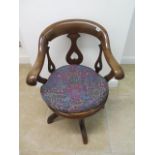 A Victorian mahogany desk armchair with inverted heart motifs - Height 82cm x Width 61cm - with