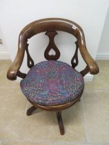 A Victorian mahogany desk armchair with inverted heart motifs - Height 82cm x Width 61cm - with