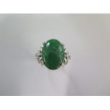 A 900 platinum green Jade and diamond ring size L/M - approx weight 10 grams - Jade approx 18mm x