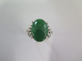 A 900 platinum green Jade and diamond ring size L/M - approx weight 10 grams - Jade approx 18mm x