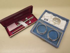 A pair of silver napkin rings, a small silver box and a silver Sheaffer pen - weighable silver