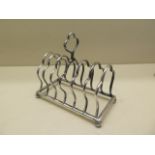 A silver toast rack London 1908/09 - Length 13cm - approx weight 4.7 troy oz - slight bending but