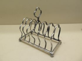 A silver toast rack London 1908/09 - Length 13cm - approx weight 4.7 troy oz - slight bending but