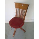 A 1920's oak desk chair