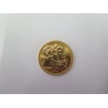 An Elizabeth II gold full sovereign dated 1974