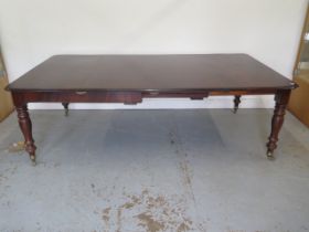 A mahogany pull out dining table with two leaves on turned legs - extends from 120cm to 230cm x 74cm