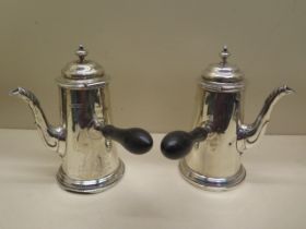 A pair of silver coffee pots - Height 17cm - Sheffield 1924/25 and 1925/26 MH Co Ltd Martin Hall &