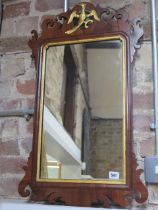 A mahogany and gilt Phoenix wall mirror - 77cm x 45cm