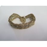 A 9ct yellow and white gold bracelet - 21mm wide - hallmarked London 1973 S&K - approx weight 42