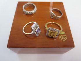 A Clogau silver Dathlu ring size K and three silver dress rings sizes I and O