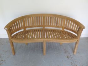 A brand new premium teak banana bench - Width 160cm x Height 84cm x Depth 57cm