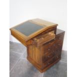 A 19th century rosewood davenport desk with a sliding top above a slide and four drawers - Height