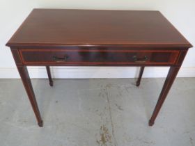 An Edwardian mahogany and crossbanded side table - in good condition - Width 93cm x Depth 50cm x