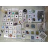 A large collection of loose gem stones including opals, quartz, citrine, tourmaline - with painted