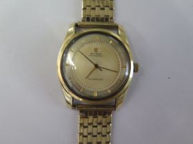 A Cyma Watersport Cymaflex manual wind gold plated wristwatch on a 9ct yellow gold bracelet