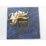 An 18ct yellow gold Mikimoto pearl brooch - Length 5.5cm - approx weight 16.2 grams - in good