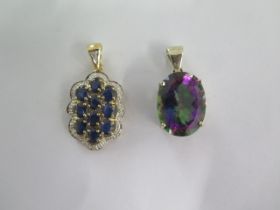 A 9ct white gold Mystic Topaz pendant and a 9ct yellow gold sapphire and diamond pendant - 30mm