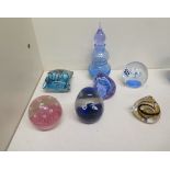 A collection of seven paperweights