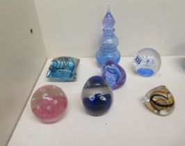 A collection of seven paperweights