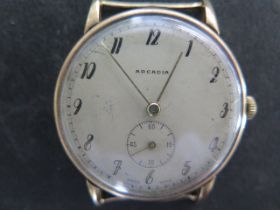 A 9ct yellow gold Arcadia manual wind gents wristwatch, 33mm case, weight without strap approx 23