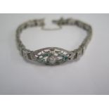 A white metal Art Deco diamond and emerald bracelet - head size 24mm x 10mm - approx weight 9.4