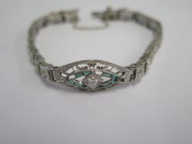 A white metal Art Deco diamond and emerald bracelet - head size 24mm x 10mm - approx weight 9.4