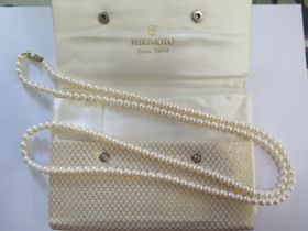 A string of Mikimoto pearls with a 14ct gold clasp - Length 109cm - pearls approx 6mm diameter -