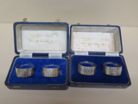 Two boxed sets of silver napkin rings - hallmarks for Birmingham, London, Sheffield and