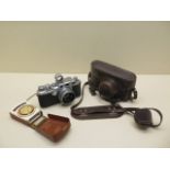 A 1949 Leica 111c 35mm camera number 472783 with leather case Summitar f=5cm 1:2 lens no 682503, 5cm