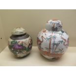 Two Oriental lidded ginger jars - Height 26cm and 21cm